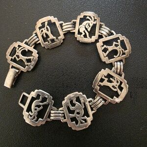 Navajo Sterlibg Silver 7 Panel Link Bracelet w/ Kokopelli- Kachina Flute Player